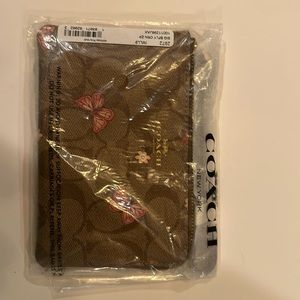 Coach Wristlet, never been used, still in original packaging.